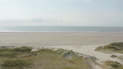 Cinematic-drone---aerial-shot-of-the-green-and-sandy-nature-beach-of-St