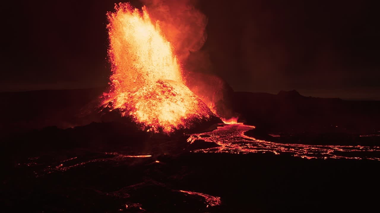Powerful volcanic eruption at night red glow Iceland 2021