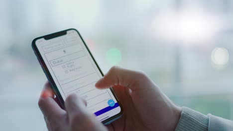 Phone-screen,-hands-and-person-planning-travel