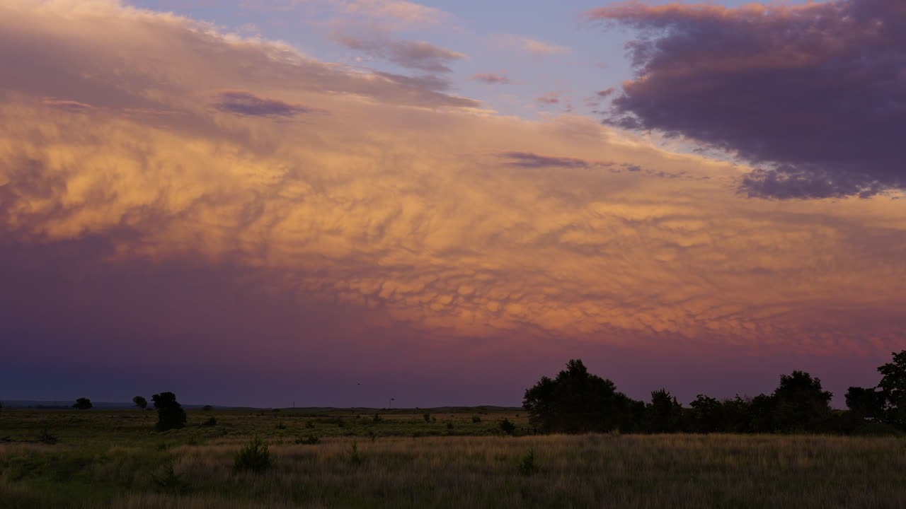Mammatus Under Distant Storm Clouds Spectacular Sun Set Colors
