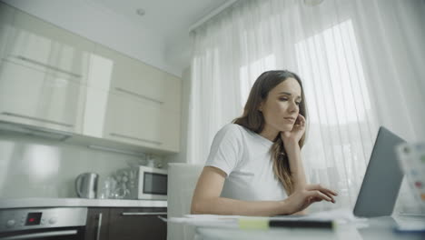 Young woman open laptop computer at home workplace. Happy person working online