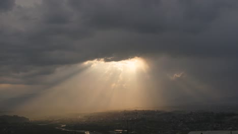 Crows-in-the-skyline-with-sunlight-popping-out-of-the-clouds-in-Changunarayan,-Bhaktapur,-Nepal