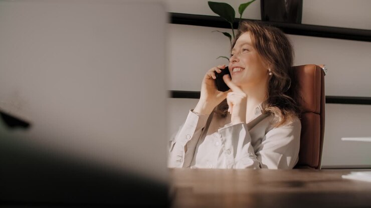 Woman on Phone in Modern Office