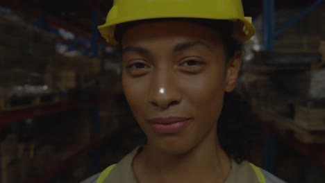 Animation-of-network-of-connections-over-biracial-female-worker-in-warehouse