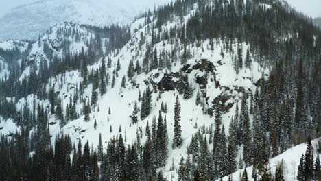 Aerial-forward-moving-shot-of-snowy-mountains