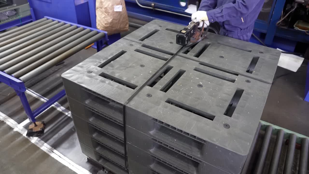 Quality Check of Plastic Pallets in Manufacturing.