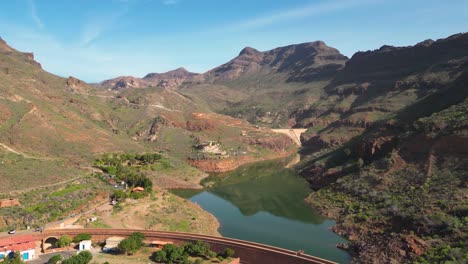 mountainous landscape with reservoir and dam