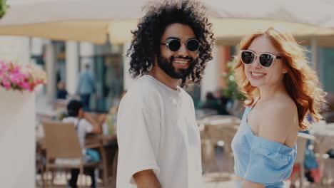 couple enjoying a sunny day at a cafe