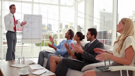 animation of data processing over diverse business people at meeting in office