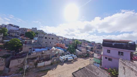 fpv shot descending over modest homes in herrera, heading towards cañada de guajimía, with a view of pipes for the new drainage