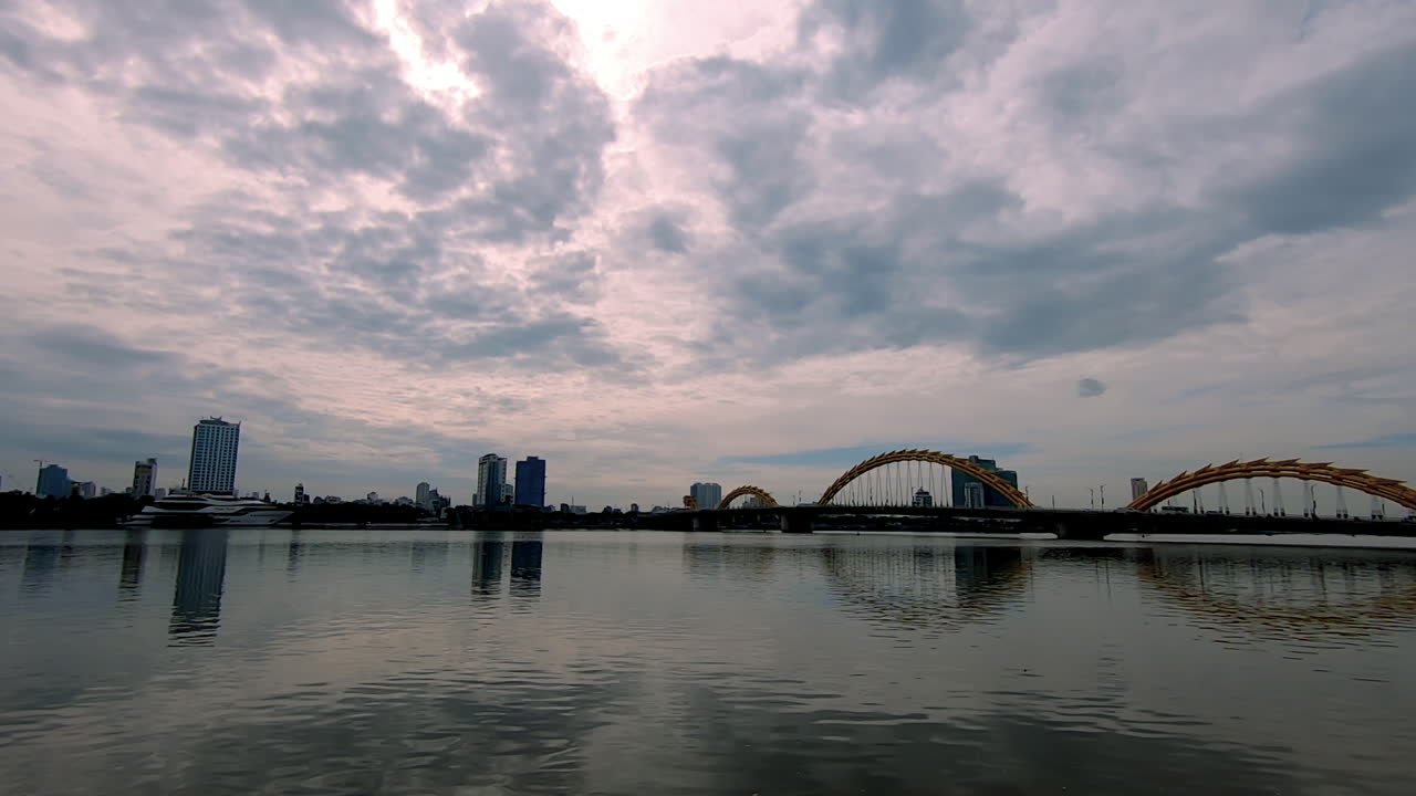 Standing and looking at the bridge in Da Nang (Vietnam).