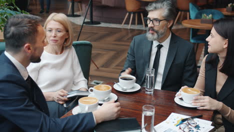 businesspeople having a meeting in a cafe
