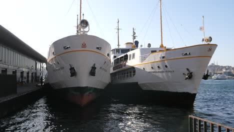 ferry boats docked at a harbor in istanbul, turkey