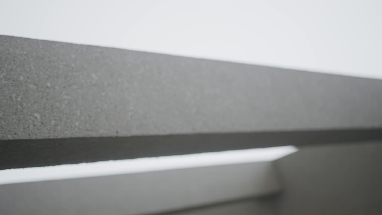 Vertical: abstract shot of concrete building pillars