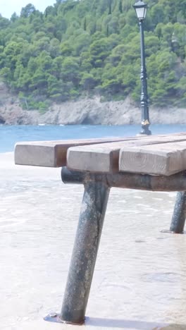 flooded park bench at the beach