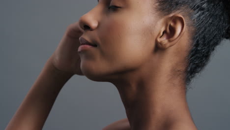 close-up-portrait-beautiful-african-american-woman-gently-touching-face-with-hands-enjoying-smooth-healthy-skin-complexion-natural-feminine-beauty-skincare-concept