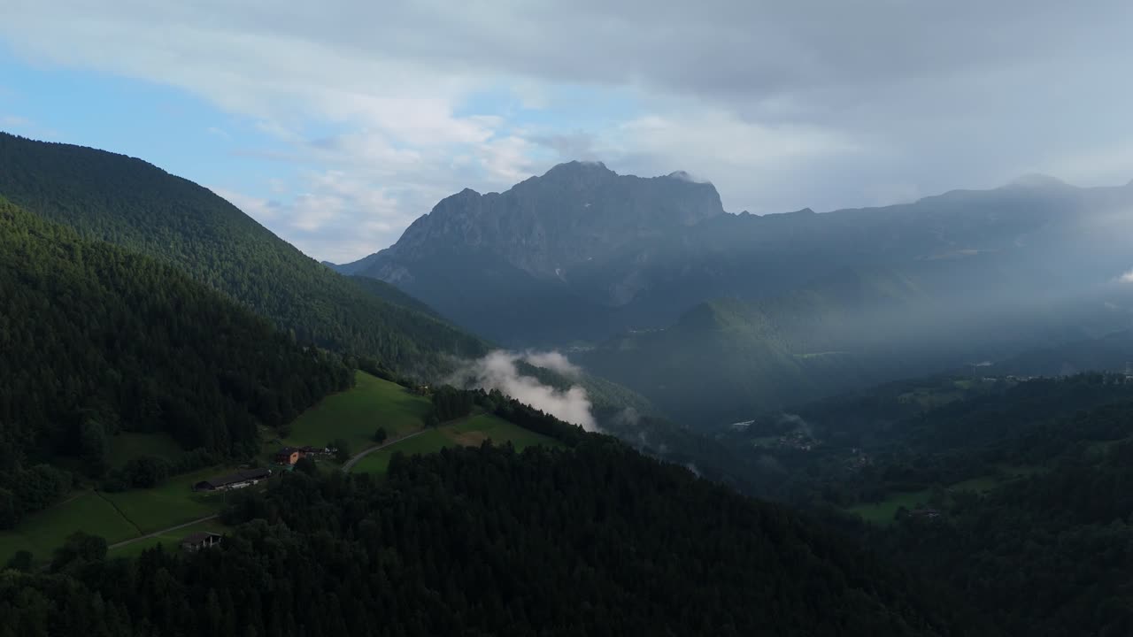 Dramatic aerial sunset over the Presolana peak in Val di Scalve, Orobie Alps. Majestic Italian mountain landscape glowing in golden evening light