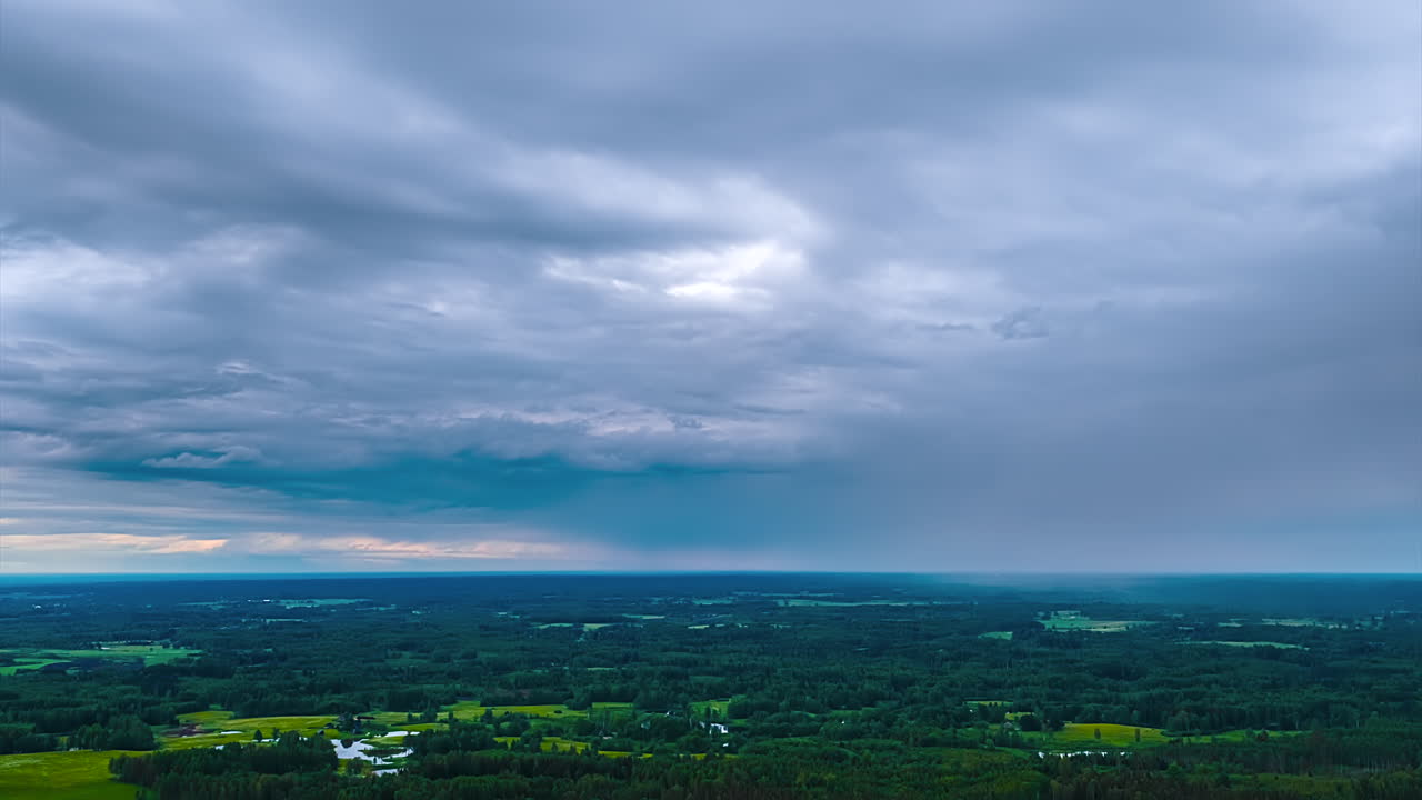 Moody Sky With Dark Clouds Passing Over Greenery Nature. Timelapse