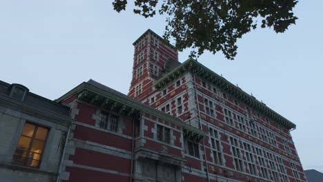 the curtius palace in liège features striking red brick architecture and historic renaissance design