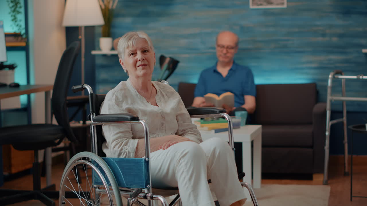 Senior Woman in Wheelchair with Husband Reading at Home