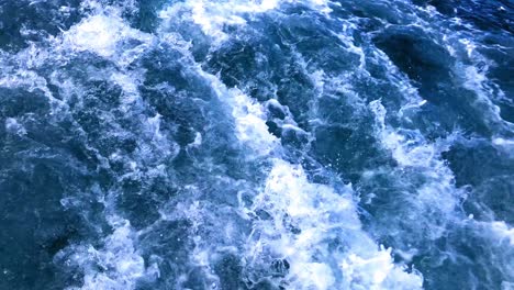 Churning-waters-of-the-Caribbean,-beautiful-crystal-clear-waters-rolling-and-bubbling-in-slow-motion