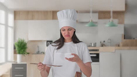 indian female professional chef tasting bad food