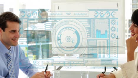 Animation-of-loading-bars,-circles-and-graphs,-diverse-coworkers-discussing-in-office