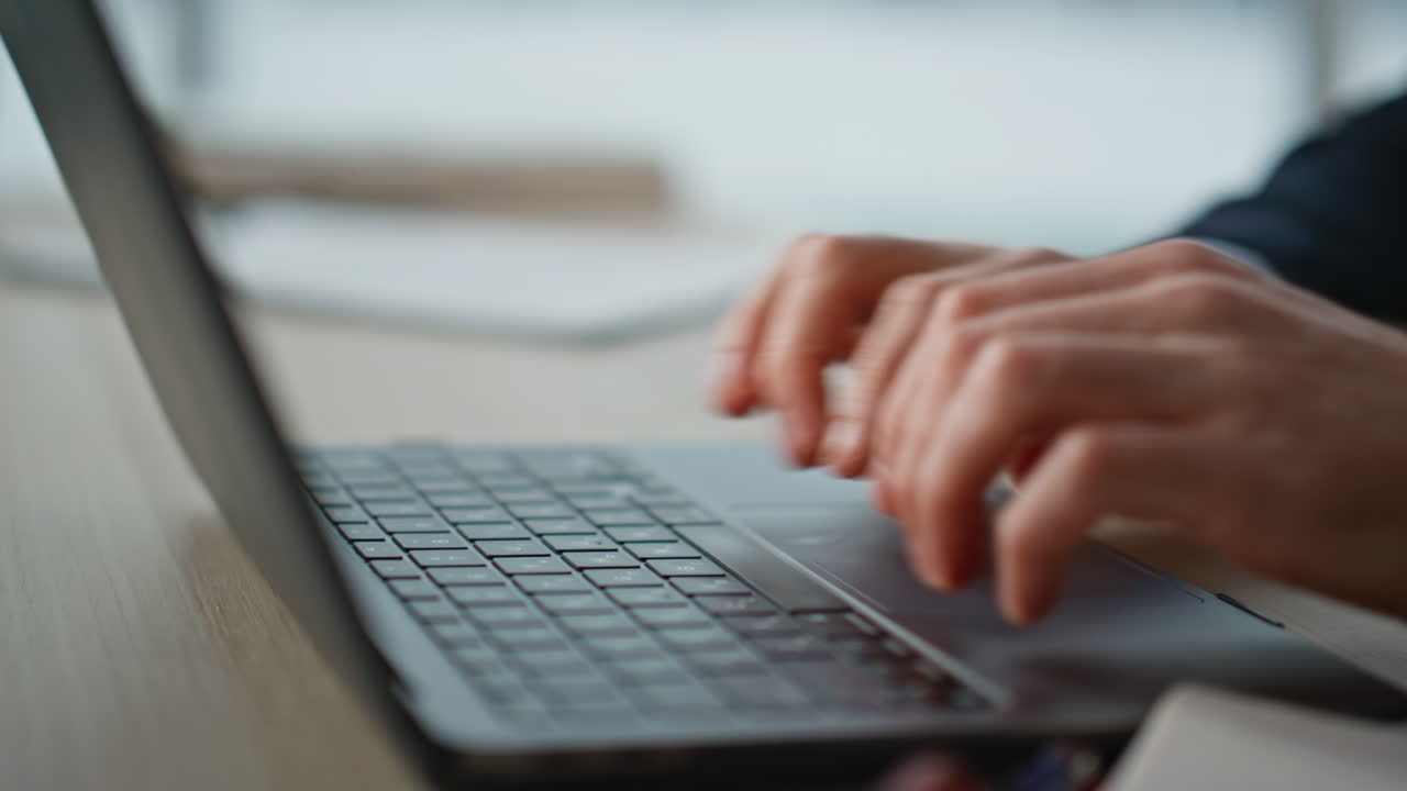 Hands inputting data computer working at business tasks closeup. Unknown man