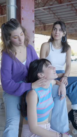 friends styling hair outdoors