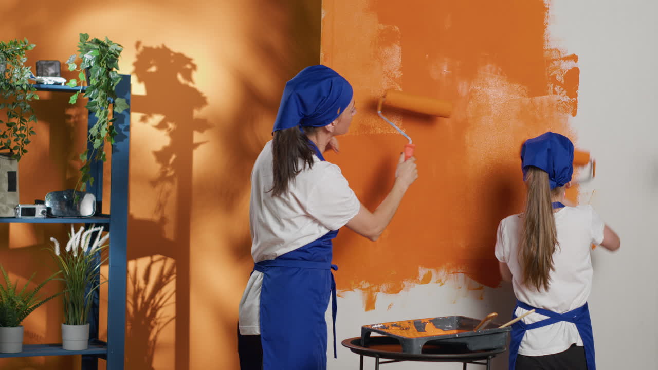 Mother and Daughter Painting Wall Orange