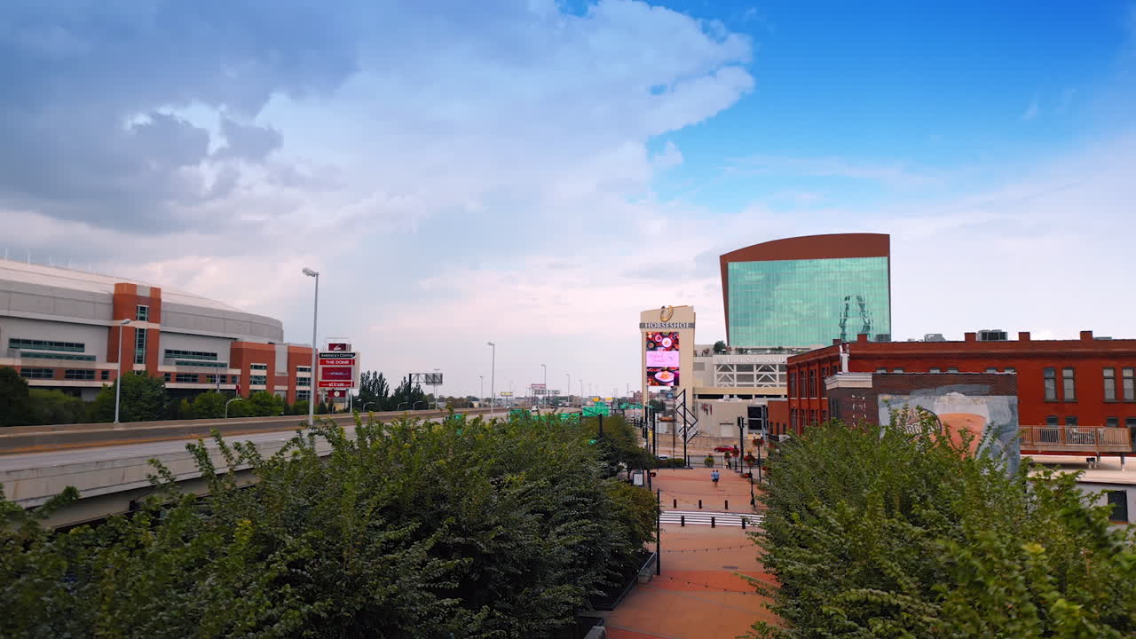 Saint Louis USA, 14 August 2025: Descending at the trestle crossing the cityscape. Low angle view at the dramatic cloudscape in the sky. St. Louis, Missouri, USA