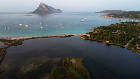 Porto-Taberna's-coastal-paradise-and-Isla-Tavolara's-majestic-presence-in-the-back