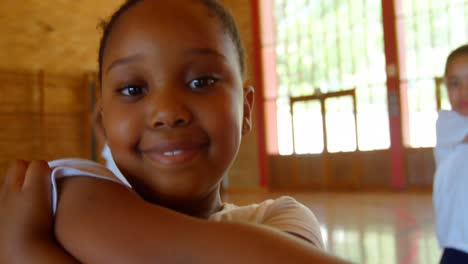 schoolkids performing yoga in elementary school 4k