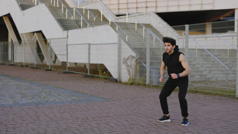 man doing jumping jacks outdoors
