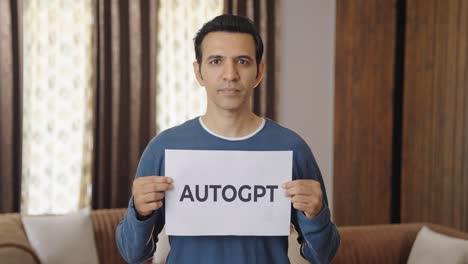 indian man holding autogpt banner