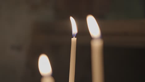 candles shining and oscillating in church