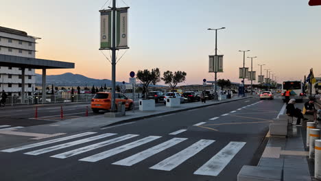 airport arrival and departure: passengers waiting at sunset