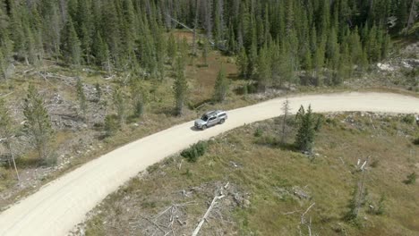 aerial of guy driving truck off-road in colorado