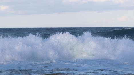 4k waves crashing on to rocks in malta