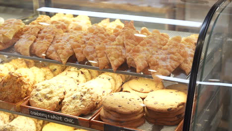 cookies and cakes on display in a bakery, australia