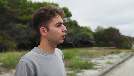 boy looks amazed at an animal in the forest at daytime in nature