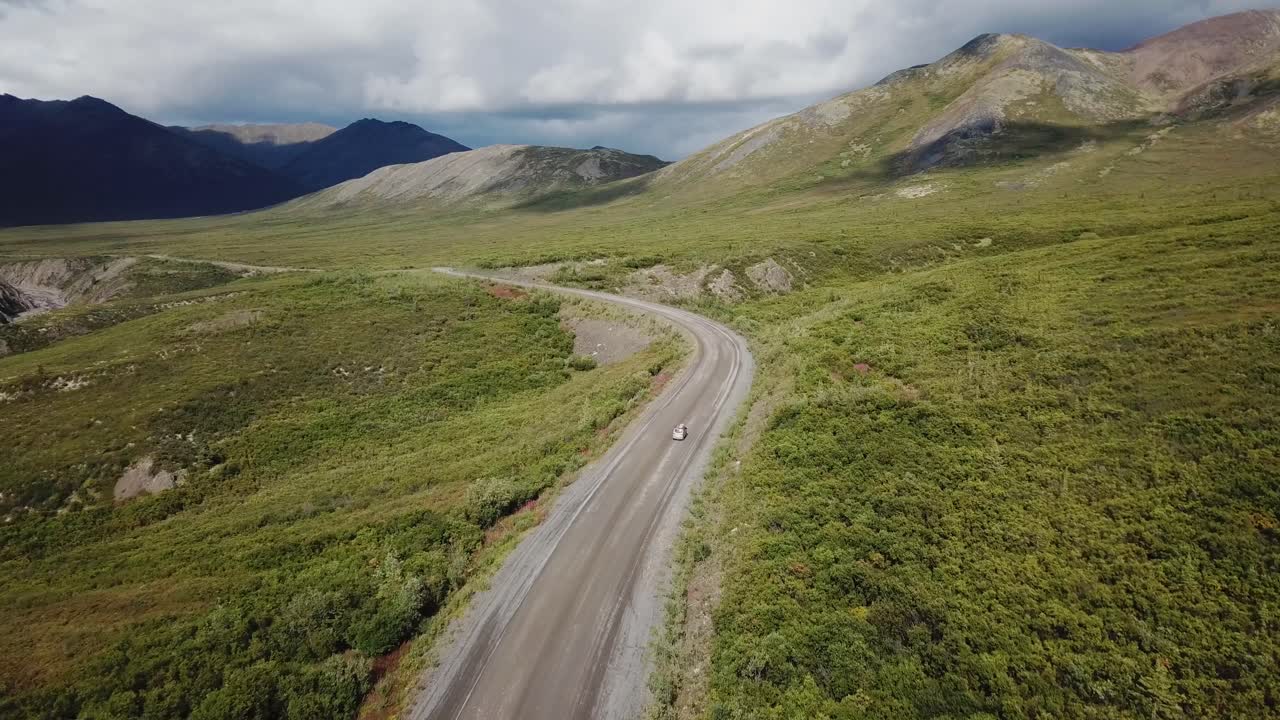 Van driving away near the Arctic Circle in Northern Canada