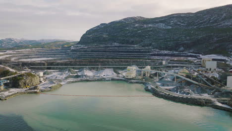 large aggregate quarry site with stockpile and apron feeder in norway