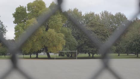 soccer field behind chain link fence