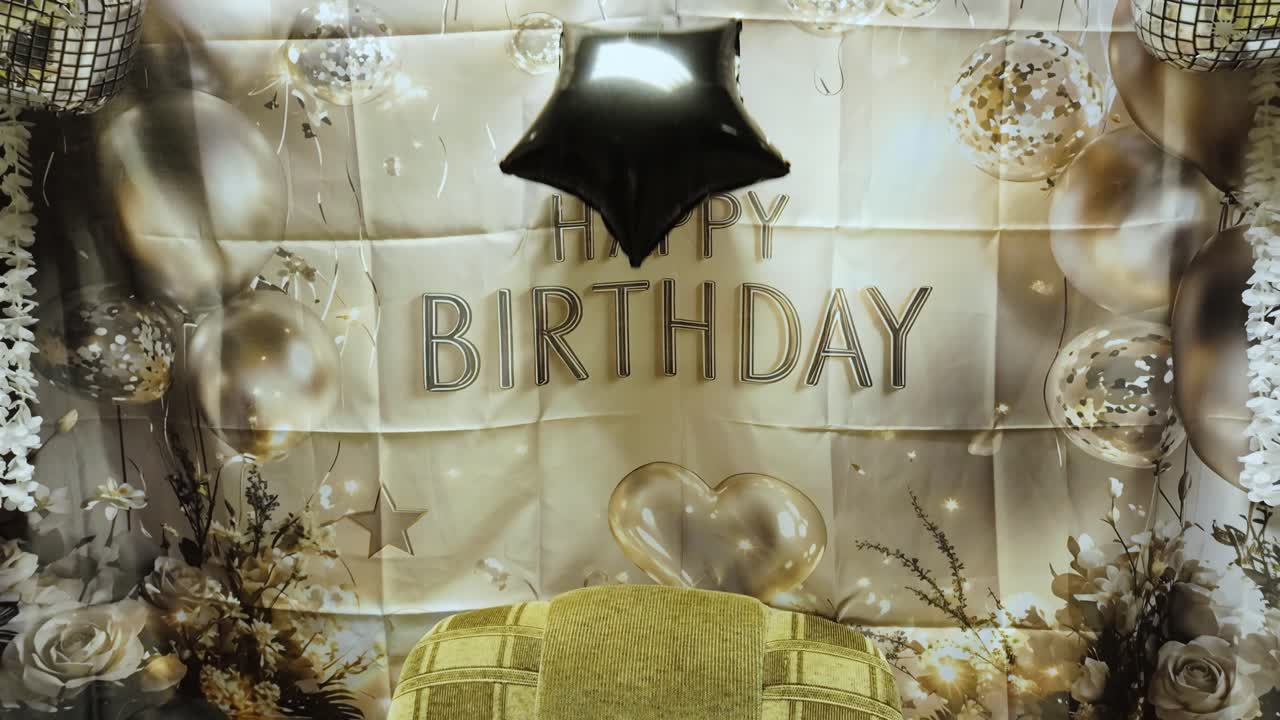 Elegant birthday decoration scene showing balloon drop and soft warm light