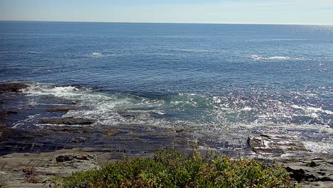 waves breaking on rocks at two lights state park near portland, maine