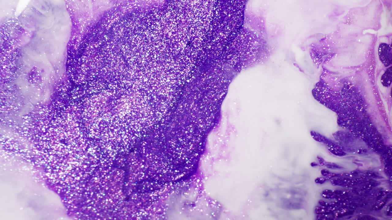 White Ink Blending With Mixture Of Purple Ink And Glitters