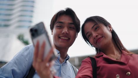 couple taking a selfie in a city