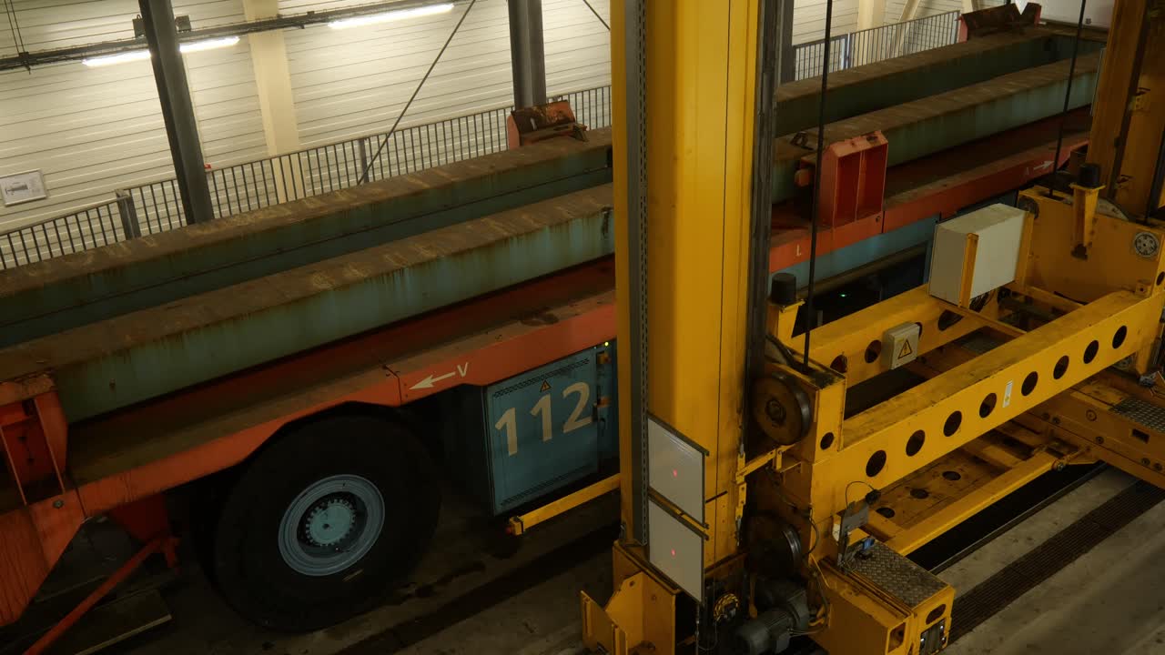 Automated Crane Machine Changing Battery Packs On Transporter At Shipping Terminal