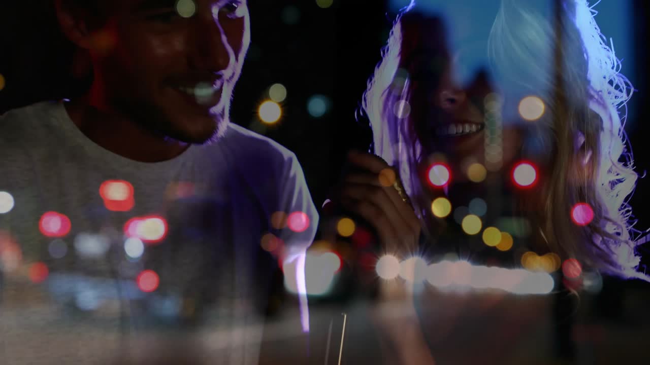 As city bokeh projection shifting, music duo leaning into handheld mic performing duet in studio